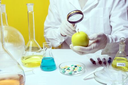Food safety inspector testing fruit from the marketの写真素材