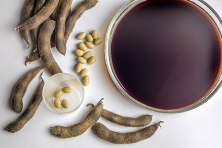 Soya beans with soya sauce on a white table. Top view.の写真素材