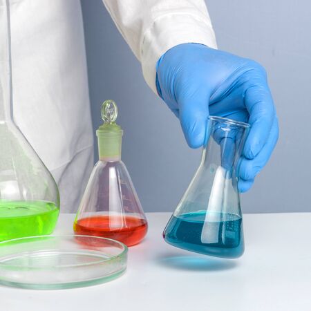 Hand of a scientific taking a sample tube test. Workplace lab assistantの写真素材