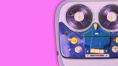 vintage analog recorder reel to reel on pink background. Top view.の写真素材