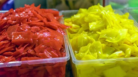 Colorful pickled vegetables. Salting various vegetables in containers for sale. Market. A variety of...