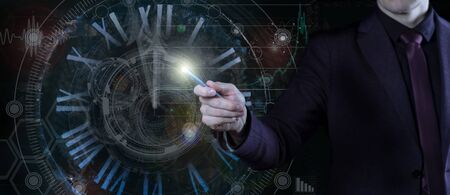 Photo business, technology and internet concept - businessman points to a virtual clock.の写真素材