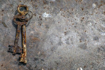 Old key vintage on metal background and texture with space.の写真素材