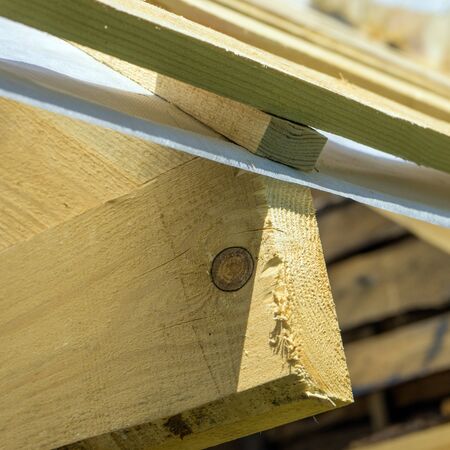 Photo wooden roof construction, symbolic photo for home, house buildingの写真素材