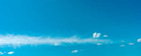 blue sky background with white clouds photoの写真素材