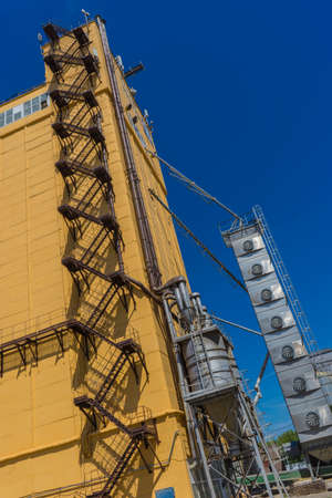 Photo Modern farm complex for storing grain, cereals, corn and oilseed rape, agriculture, cone, close-up, building, agri-businessの写真素材