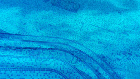 top view at a swimmingpool with blue mosaic tilesの写真素材