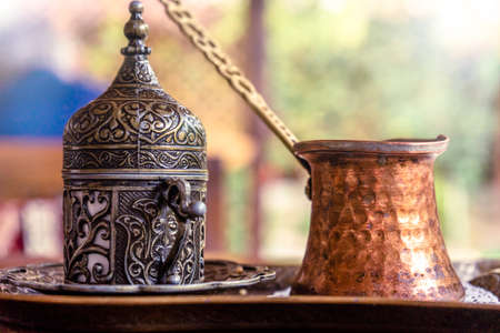 Turkish coffee with traditional embossed metal tray and cupの写真素材