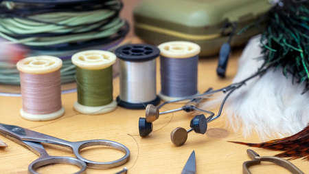 Photo Fly tying equipment and materials in preparation of making trout fliesの写真素材