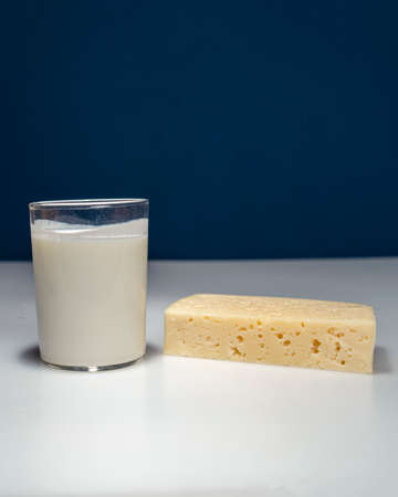 Photo still life with dairy products cottage cheese and yogurt on a white background.