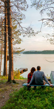 sunset under the tree at lakeの写真素材