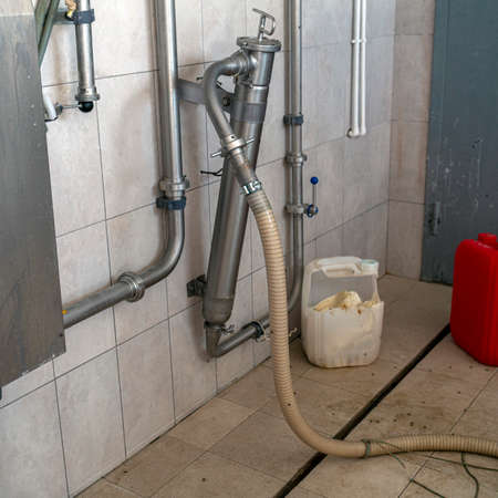 Dairy production. Details and accessories of a washing machine for bottling dairy products.の写真素材
