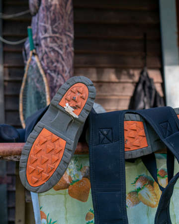 fly landing net and waders drying after successful fishing on the river.の写真素材