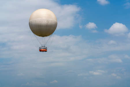 Hot air balloon on the blue sky. Travel natural background.