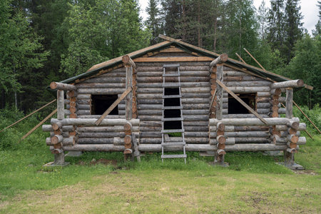 Construction site of wooden mountain house. Traditional log cabin built from wood logs.. Cottage house designの写真素材