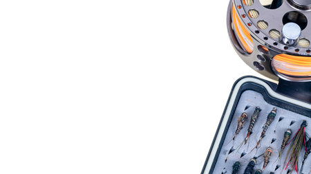 Closeup of fly fishing reel on white background.の写真素材