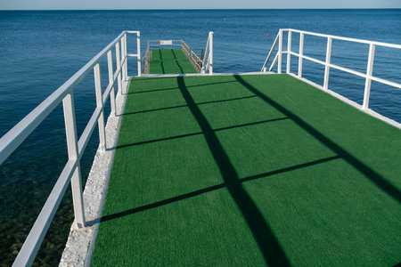 View of the pier in the Black Sea bay, summer concept of tourism and recreationの写真素材