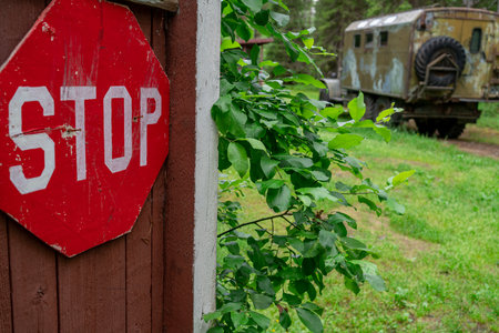 Military checkpoint, stop sign. Military truck in the backgroundの写真素材