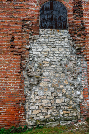 Ancient Fortress. arch door made by stone place. old brick wall background.の写真素材