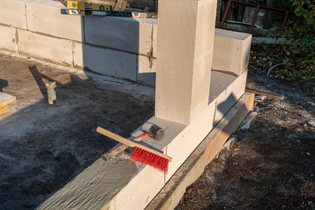 Erection of walls, brick laying on construction site, engineering and construction concepts.の写真素材