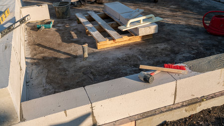 Erection of walls, brick laying on construction site, engineering and construction concepts.の写真素材