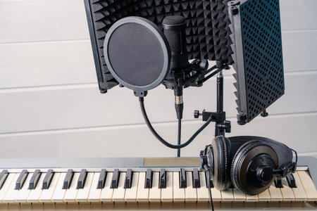 Keyboard instrument, microphone, headphones. Home recording studio.の写真素材