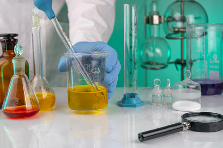 young man scientist in chemistry bright labの写真素材