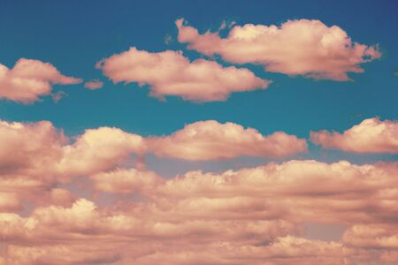 The blue sky and beautiful white clouds.