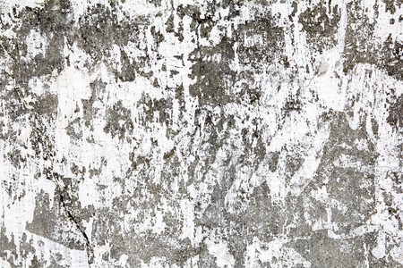 An old plastered wall that has cracked peeled and faded into a nice texture patternの写真素材