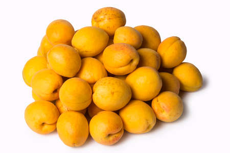 Pile of fresh ripe organic apricots isolated on a white backgroundの写真素材