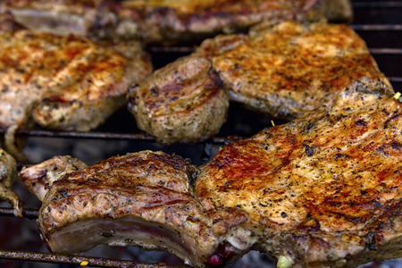 Delicious chuck steaks on the grill. Shallow depth of field.**Note blurriness, best at small sizes.