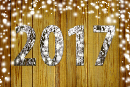 Christmas wooden background with snow flakes. Brown wood texture with white snow - View with copy spaceの写真素材