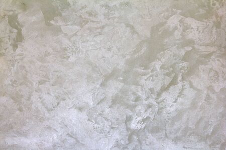 Closeup white concrete wall texture with round plaster decorative pattern