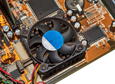 Part of computer motherboard with processor, radiator and cooler