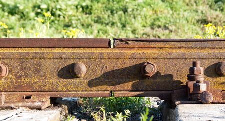 Joint of rusty railway rails close upの写真素材