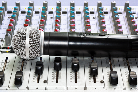 Mixing console and a wireless microphone closeupの写真素材