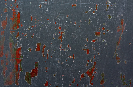Abstract gray background with scratches and colored spots