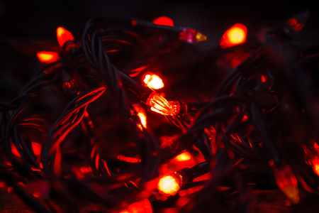Background of colored lights garlands in the darkの写真素材