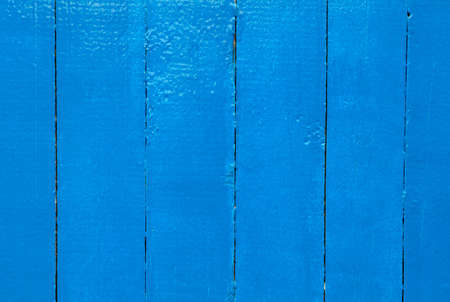 Background from wooden planks painted with blue paintの写真素材