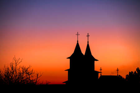 Beautiful sunset sky and silhouette of the churchの写真素材