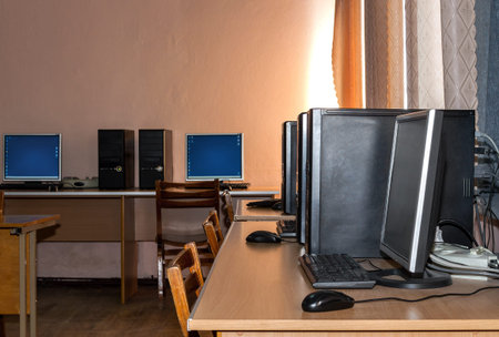 Part of a computer room with classic desktop computers