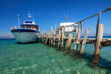 Ship in the harbor on the sea in Corfu,Greece の写真素材