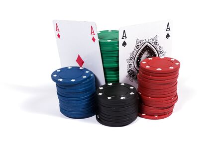 Poker chips and cards on white background