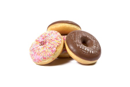 Delicious chocolate and strawberry donuts on white backgroundの写真素材