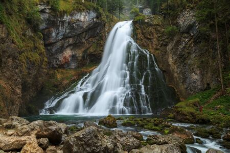 Beautiful Golling waterfall and near Golling and Salzach medieval town at autumn in Austria