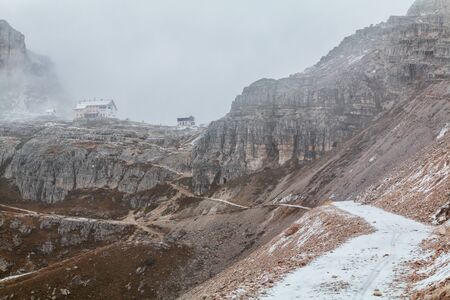 Tre Cime di Lavaredo in beautiful surroundings in the Dolomites at foggy weather in Italy, Europe (Drei Zinnen)の写真素材