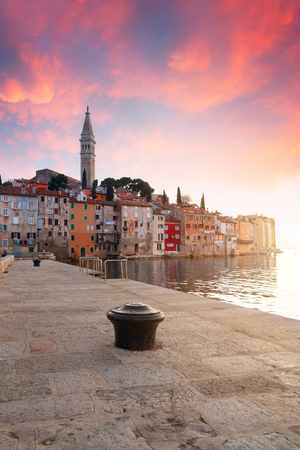 Sunset at medieval town of Rovinj, colorful with houses and church in Croatiaの写真素材