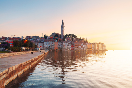Sunset at medieval town of Rovinj, colorful with houses and church in Croatiaのeditorial素材