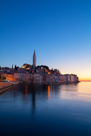 Sunset at medieval town of Rovinj, colorful with houses and church in Croatiaの写真素材