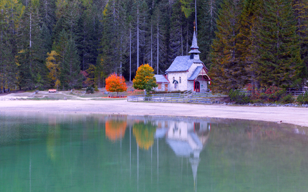 Braies lake and church in the background of Seekofel mountain in Dolomites,Italy ( Pragser Wildsee )の写真素材